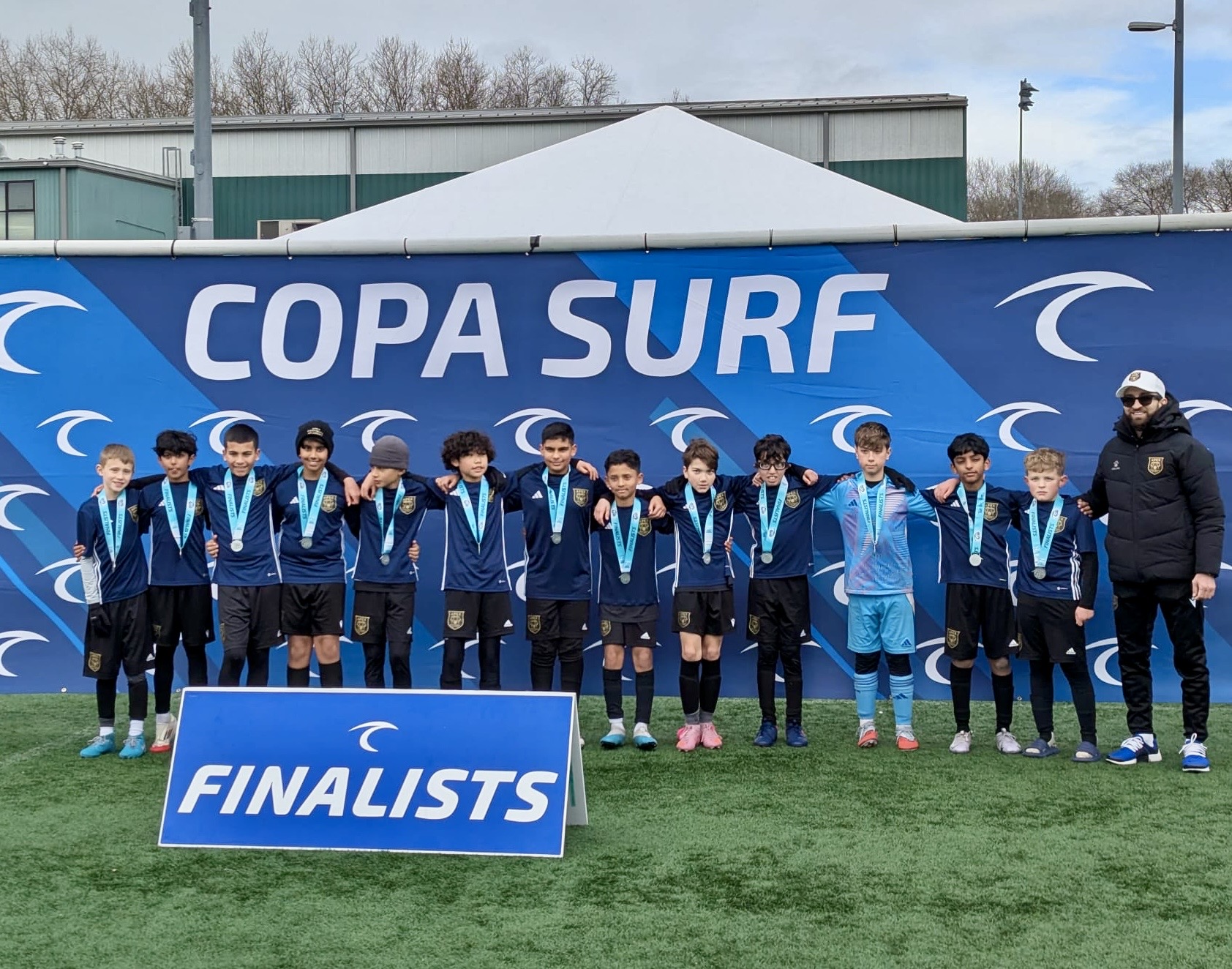 Apex Football Academy player competing against Feyenoord O11 at Feyenoord Rotterdam training complex